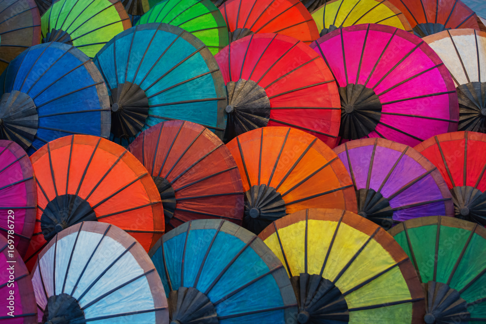 Layers of umbrellas in multiple bright colors.